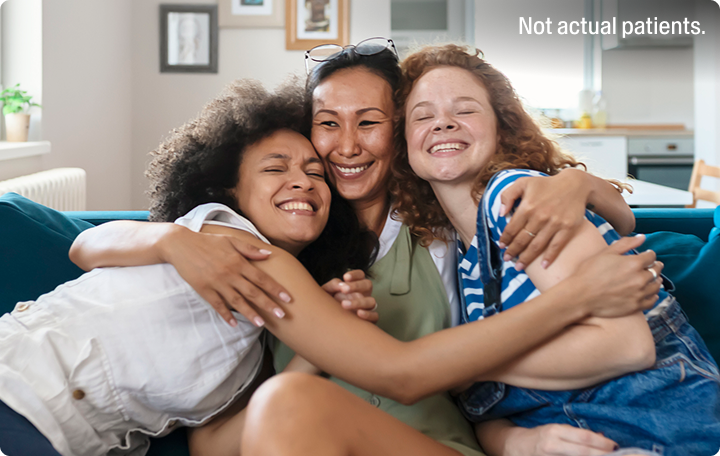 Three friends hugging
